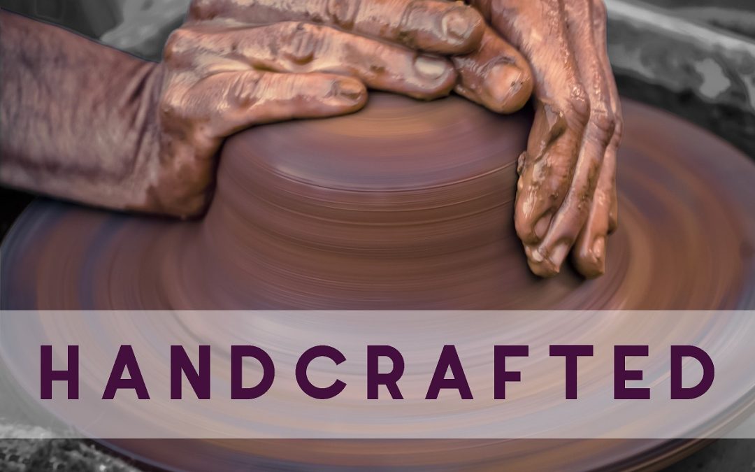 Hands working on pottery wheel