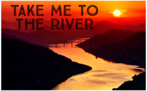 A deep red and orange sunset over a winding river traversed by two bridges in the distance with the text "Take Me to the River"